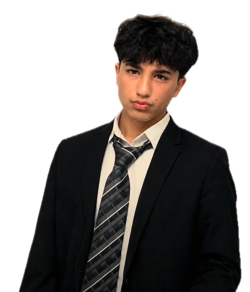 Sayed Sultani in a black suit and striped tie